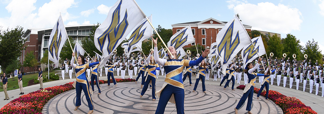 The University of Akron marching band performs in the center of campus